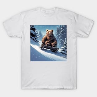 Teddy on a sledge riding down a hill in the snow T-Shirt